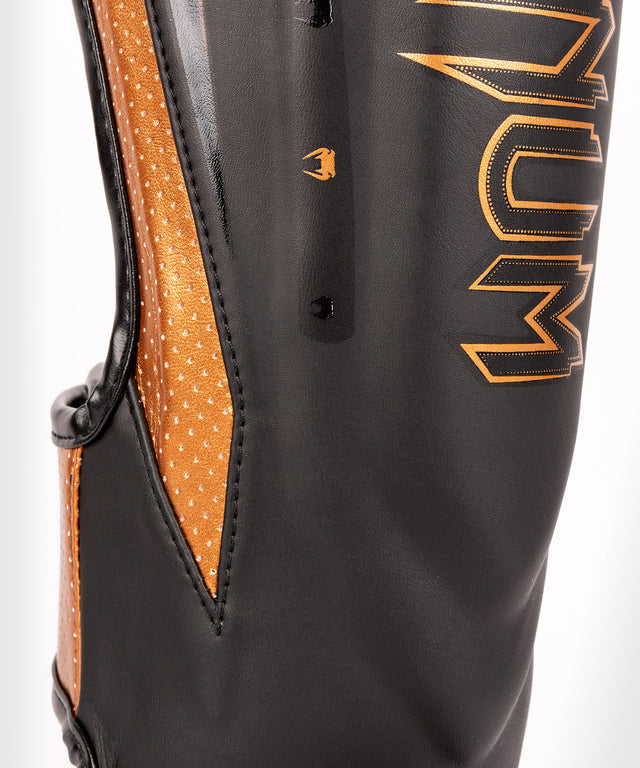 Protège-tibias Venum Elite Evo – Noir/Bronze