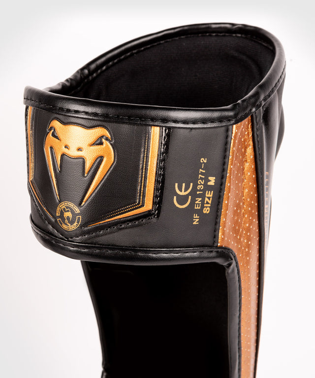 Protège-tibias Venum Elite Evo – Noir/Bronze