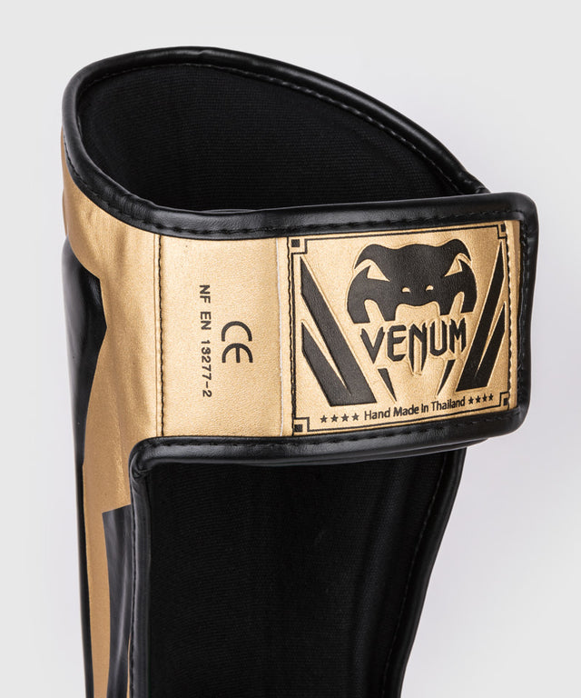 Caneleiras Venum Elite – Ouro/Preto