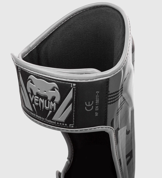 Paratibie da kickboxing Venum Elite – Camo Grigio – Paratibie