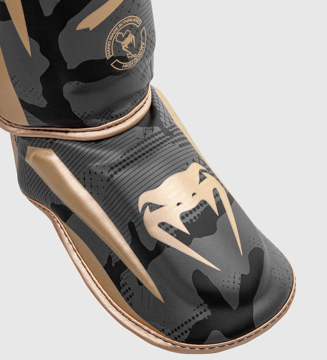 Paratibie da kickboxing Venum Elite – Camo Grigio/Oro – Paratibie