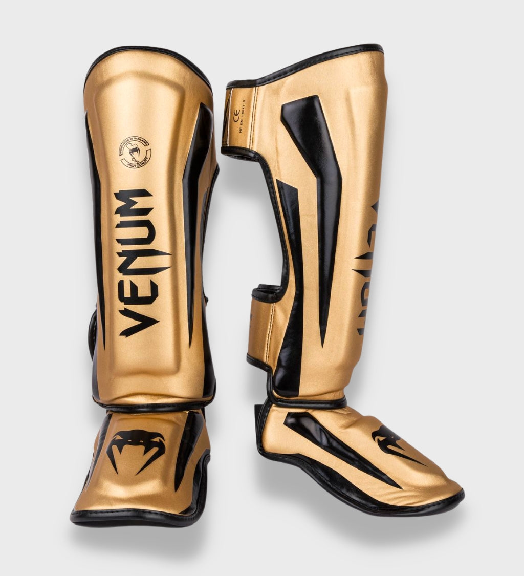 Venum Kickboks Scheenbeschermers Elite - Goud/Zwart - Scheenbeschermers