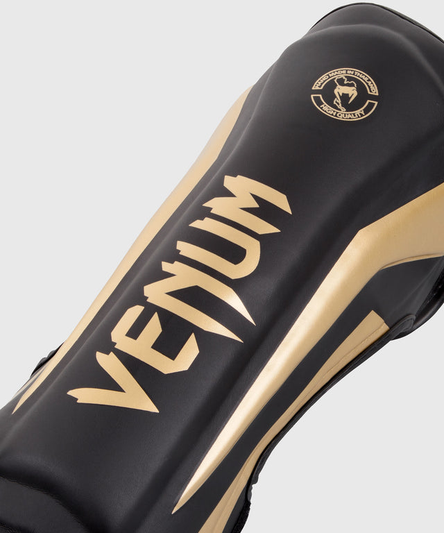 Tibiere Venum Elite – Negru/Auriu