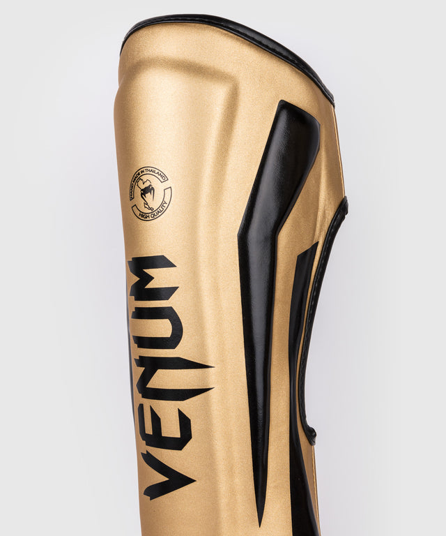Caneleiras Venum Elite – Ouro/Preto