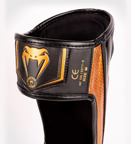 Venum Kickboks Scheenbeschermers Elite Evo - Zwart/Brons - Scheenbeschermers